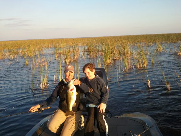 helping a little guy land his big O bass