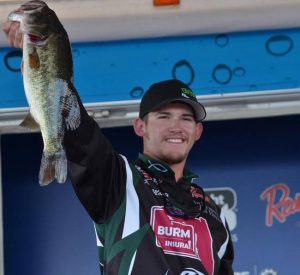 Capt. Kyle Monti holding a bass